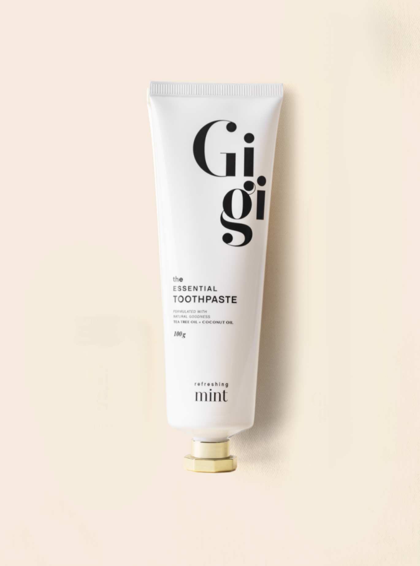 Gigi toothpaste tube on a beige background
